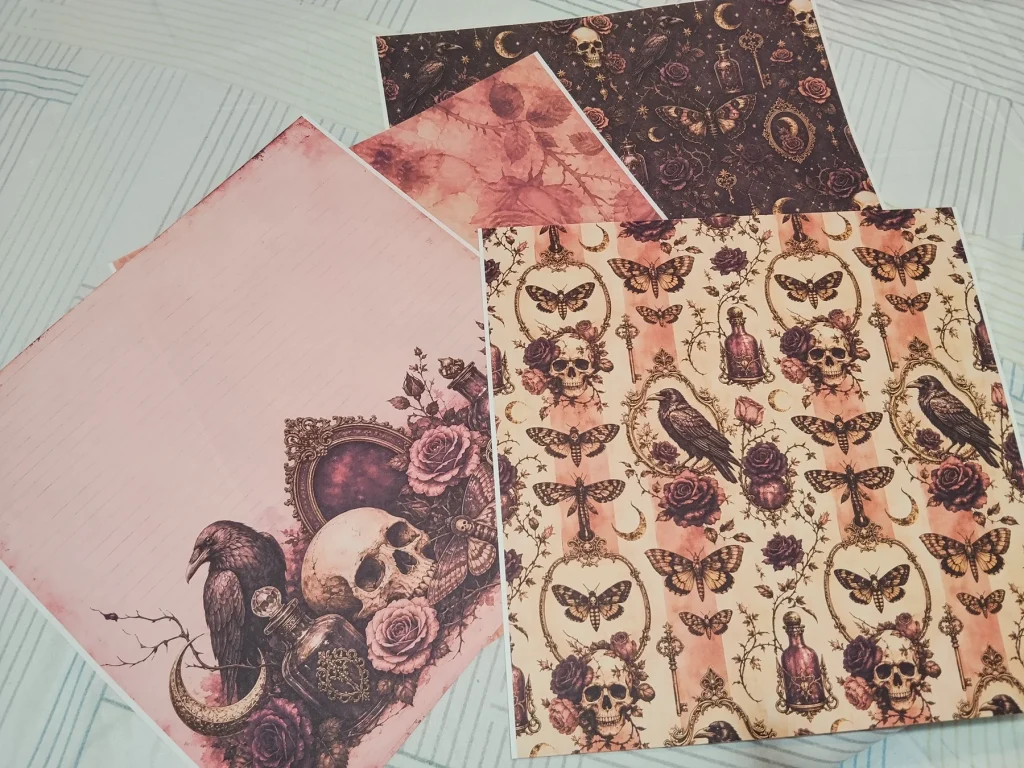 Printed Gothic Halloween papers with ravens, skulls, moths, roses and botanical motifs