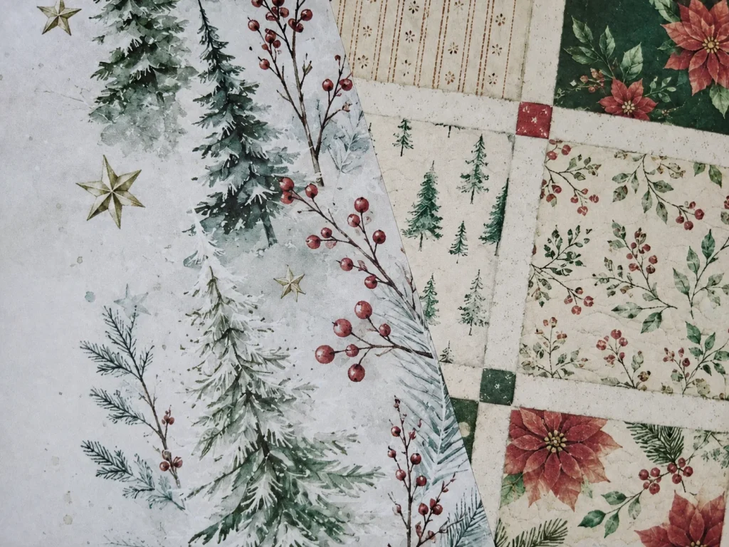 Close-up of printed watercolor Christmas trees, berries, quilt blocks and poinsettias